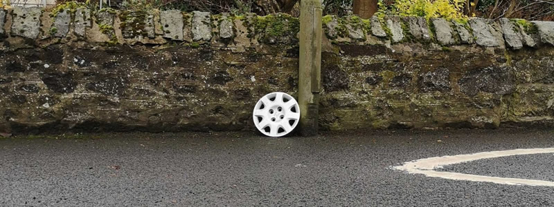 Unfilled potholes on a UK road