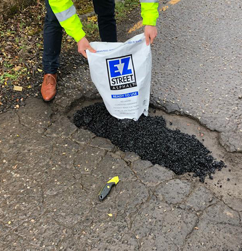 Step 2: filling the pothole with EZ Street Asphalt